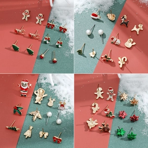 Christmas stud earring set featuring Santa, snowman, and reindeer motifs in festive colors