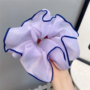 Elegant purple chiffon hair scrunchie with blue stitched edges and soft pleats