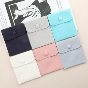 Velvet jewelry pouches in multiple colors with snap buttons for rings and necklaces
