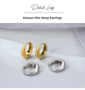Minimalist C-shaped thick hoop earrings in gold and silver with matte brushed finish