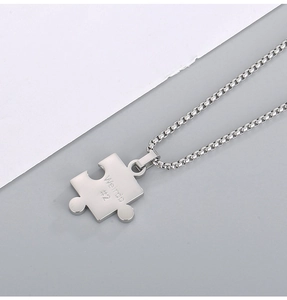 Polished silver stainless steel puzzle pendant necklace featuring Weirdo and #2 engravings