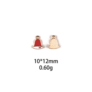 Macro detail of red and white Christmas bell charm pendant with rhinestone, 10x12mm size