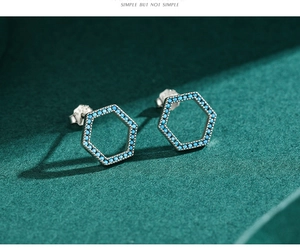 Macro view of S925 sterling silver hexagonal stud earrings with turquoise blue beads