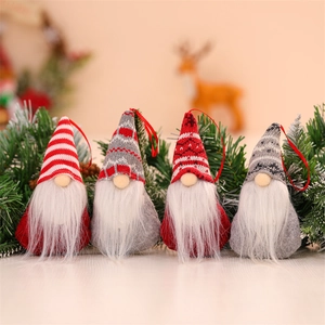 Detailed close-up of 4-pack knitted Christmas gnome ornaments with red and grey textures