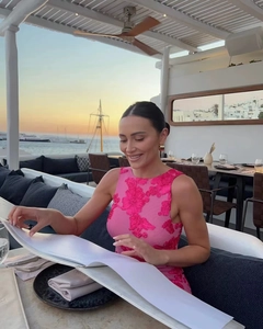Pink mesh evening dress with floral embroidery detail at a romantic sunset dinner