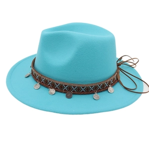 Detail of sky blue felt hat with bohemian patterned band and silver metal charms