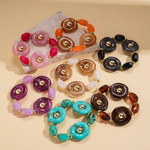 Set of acrylic beaded bracelets with gold metal accents in various vibrant colors