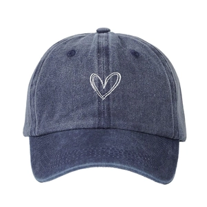 Vintage washed navy blue baseball cap featuring a white embroidered heart on the front