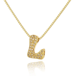 Macro shot of gold letter L pendant with pavé set sparkling zircons on a box chain