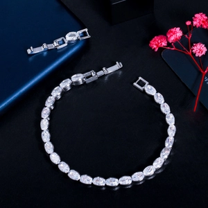Detailed macro shot of elegant silver bracelet with oval zircons and folding clasp closure