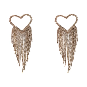 Elegant gold heart-shaped earrings with long sparkling rhinestone tassels on white backdrop