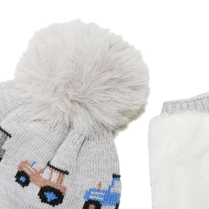 Detail of grey knitted kids hat and scarf set with soft white fleece lining and tractor design