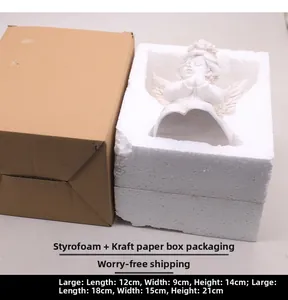 White angel sculpture with protective foam padding and cardboard box packaging dimensions