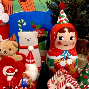 Detail view of Merry Christmas cake toppers with bear, snowman and Santa Claus figures