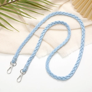Detailed view of a hand-woven blue braided strap with durable silver metal clasps