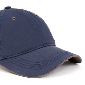 Navy cotton baseball cap with curved brim, brown edge trim and metal eyelets for summer
