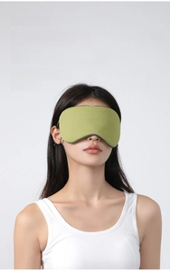 Detail of green ice silk sleep mask with W-shaped nose fit for total blackout comfort