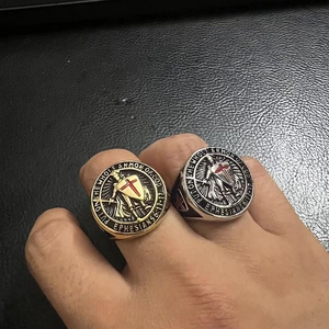 Close-up of gold and silver Templar rings with Bible verse Ephesians 6:13-17