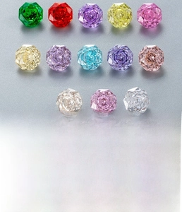 Macro display of 8mm multifaceted cut zircon stones in thirteen various vibrant colors