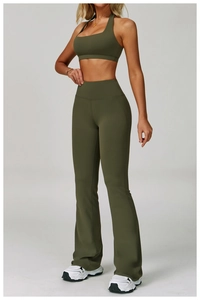 Macro shot of army green yoga set featuring halter neck top and flared high-waist pants