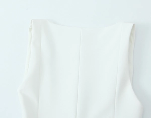 Detailed close-up of a white stretch tank top featuring a clean flat neckline design