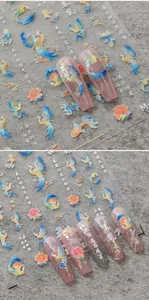 Macro detail of 3D embossed Phoenix and cloud nail art stickers with iridescent finish