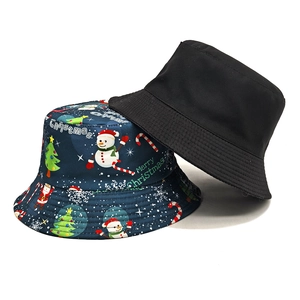 Navy blue bucket hat with Christmas tree snowman patterns and reversible black side