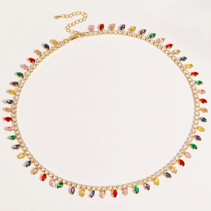 Detail of gold-plated choker necklace with colorful teardrop zircons and crystal pavé