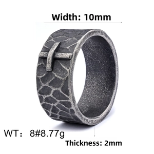 Detailed view of 10mm retro textured ring featuring a cross emblem and hammered finish