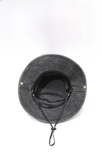 Detail of breathable eyelets and adjustable windproof drawstring on dark grey sun hat