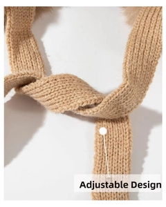 Detail showing the adjustable design and thick knit texture of this camel winter hat