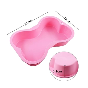 Pink silicone bone shaped cake mold with dimensions 17cm by 12cm by 5.1cm height