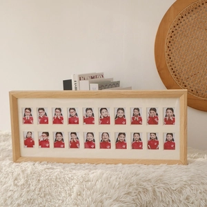 Natural wood multi-photo frame with 20 openings for displaying baby growth milestones