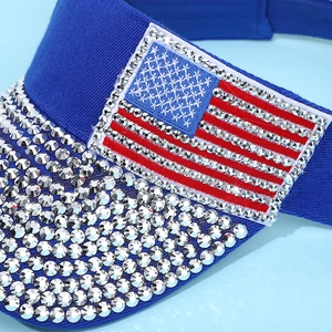 Detail of royal blue canvas visor featuring shimmering US flag rhinestone embroidery
