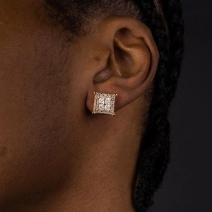 Gold square stud earrings with zircons shown on a model for a luxury hip-hop look