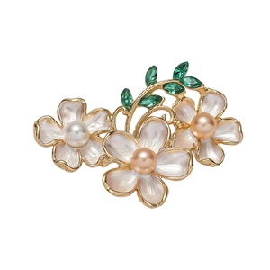 Elegant floral brooch with enamel petals, faux pearls and green gemstone leaves on gold plating