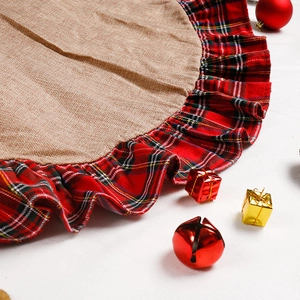 Linen Christmas tree skirt featuring red plaid ruffled edges and festive holiday ornaments