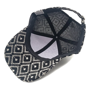 Detail view of baseball cap interior with sweatband, seams and metal buckle