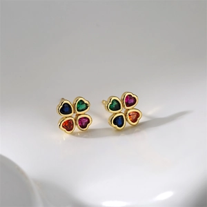 Close-up of four-leaf clover stud earrings with multi-color heart gemstones in gold setting
