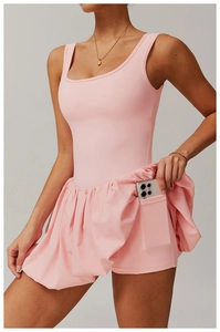 Detailed shot of pink tennis dress featuring built-in shorts and a functional phone pocket