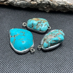 Three natural turquoise stone connectors with silver leaf edging for DIY jewelry making