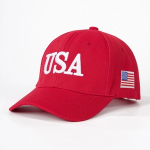 Red baseball cap with USA embroidery and American flag patch on a white background
