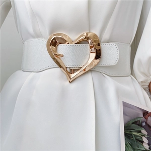 White leather wide waist belt featuring a gold irregular heart-shaped metal buckle
