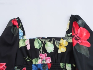 Close-up of square neck detail on black floral print puff sleeve blouse for women