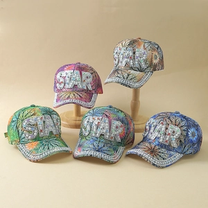 Floral baseball caps with STAR rhinestones in multiple colors on wooden stands