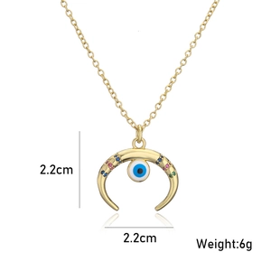 Detail view of 18K gold plated evil eye moon necklace with size 2.2cm and weight 6g