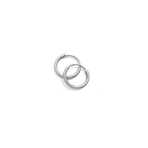 Pair of polished silver round hoop earrings for women and men on white background