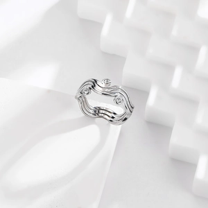 Macro detail of silver S925 stainless steel wave ring with cubic zirconia stones