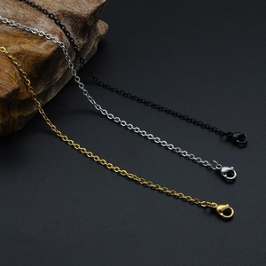 Detailed view of gold, silver, and black stainless steel O-chains with lobster clasps