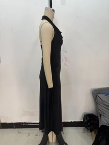 Side view of elegant black lace velvet midi dress with halter neck and backless design